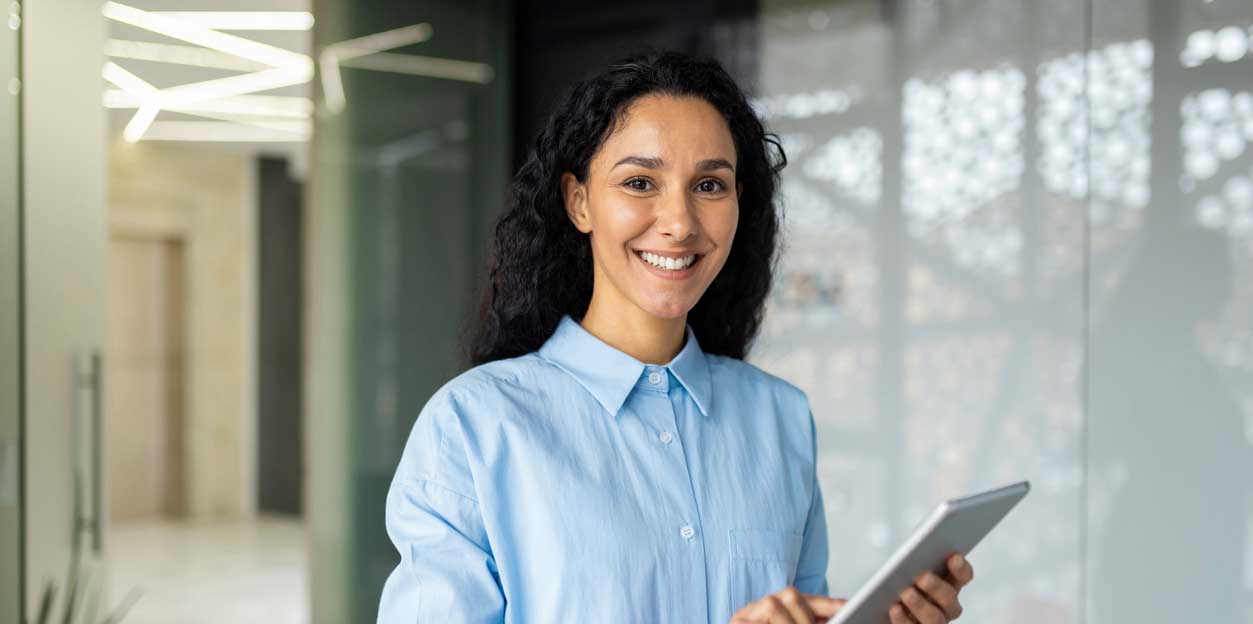 Image of a female interior designer holding a tablet